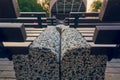 Benches standing tightly together, around the stage. A place for concerts and entertainment of people during the holidays.