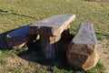 Benches and table made from a single wooden trunk in a cottage