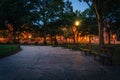 Benches and walkway at Logan Circle at night, in Washington, DC. Royalty Free Stock Photo