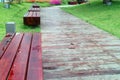 Benches by wooden road