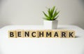 BENCHMARK word made with building blocks, process concept.