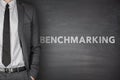 Benchmarking text on black blackboard Royalty Free Stock Photo