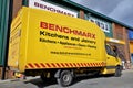 Benchmarx Kitchens and Joinery delivery van outside retail store