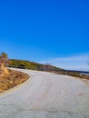 Bend in the road to the hills Royalty Free Stock Photo