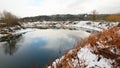 Bend in the Snoqualmie River with snow on the banks and reflection