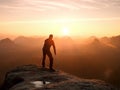 Bended man with broken leg and medicine crutch. Hiker with leg in immobilizer Royalty Free Stock Photo