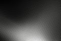 Bended surface of grey woven carbon fibre composite sheet. Royalty Free Stock Photo