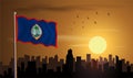 Guam Flag with building silhouette and sunset