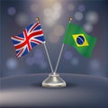 United Kingdom VS Brazil flag Relation in a stand on table Royalty Free Stock Photo