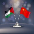 Palestine VS China flag Relation in a stand on table Royalty Free Stock Photo