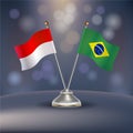 Indonesia VS Brazil flag Relation in a stand on table Royalty Free Stock Photo
