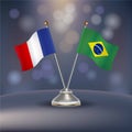 France VS Brazil flag Relation in a stand on table Royalty Free Stock Photo