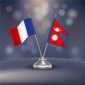 France VS Nepal flag Relation in a stand on table Royalty Free Stock Photo