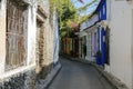 Bending narrowsStreet in the old town of Cartagena with colorful one-story houses partly covered with flowering plants on a sunny Royalty Free Stock Photo