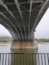 Beneath the bridge\'s steel embrace Royalty Free Stock Photo