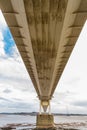 Underside of large road suspension bridge, portrait Royalty Free Stock Photo