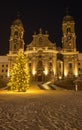 Illuminated swiss abbey of Einsiedeln in snowy Christmas time and winter night