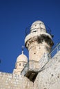 Benedictine Dormition Abbey bell tower stands parallel to a Muslim mosque minaret in Jerusalem Royalty Free Stock Photo