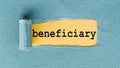 BENEFICIARY word on yellow background under blue paper layer