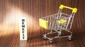 BENEFIT word made from building blocks, next to a toy grocery cart Royalty Free Stock Photo