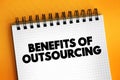 Benefits of Outsourcing text concept on notepad for presentations and reports