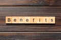 Benefits word written on wood block. Benefits text on wooden table for your desing, Top view concept Royalty Free Stock Photo