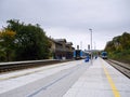 Benesov nad Ploucnici, Czech republic - September 29, 2019: historical train station with blue trains of Ceske drahy company in Royalty Free Stock Photo