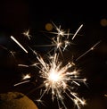 Bengal fire sparkles against the background of city lights, blurred bokeh Royalty Free Stock Photo