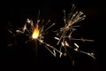 Bengal fire sparkles against the background of city lights Royalty Free Stock Photo