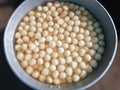 Bengal`s famous sweet `rasogolla` is kept in an aluminum tray Royalty Free Stock Photo