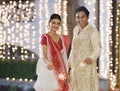 Bengali couple burning firecrackers