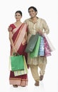Bengali couple carrying shopping bags