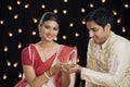 Bengali couple holding an oil lamp