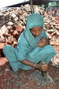 Bengali Mother with baby working as stone breaker