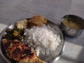 Bengali staple food of rice and fish served in a plate with other side dishes like lentils, boiled potato etc Royalty Free Stock Photo