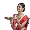 Bengali woman holding pooja thali