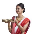 Bengali woman holding pooja thali