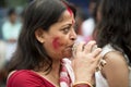 Bengali woman playing shankh