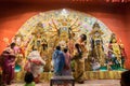 Bengali women worshipping Goddess Durga at Puja pandal, Kolkata, West Bengal, India.