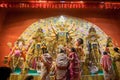 Bengali women worshipping Goddess Durga at Puja pandal, Kolkata, West Bengal, India.