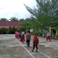 Bengkalis, Riau - July, 14 2021:situation during the pandemic, some students are queuing to wash their hands before go home