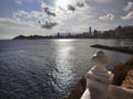 Cityscape with shoreline and skyscrapers at sunset. Skyline. Royalty Free Stock Photo