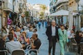 Benidorm, Spain - 01 April, 2023: People in crowdy streets of Benidorm old town. People relaxing in outdoors cafes