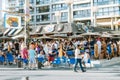 Benidorm, Spain - April 01, 2023: People enjoy vacation in popular Tiki beach bar. Benidorm - popular Spanish resort