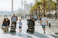 Benidorm, Spain - April 01, 2023: People relaxing, walking along Levante beach seaside promenade. Benidorm - popular