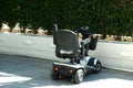 Benidorm, Spain - May 01, 2023: Four wheel mobility electric scooter charging up. Personal transport for seniors or