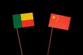 Benin flag with Chinese flag isolated on black