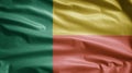Beninese flag waving in the wind. Close up of Benin banner blowing, soft silk