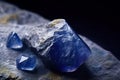 Benitoite is a rare precious natural stone on a black background. AI generated. Header banner mockup with space. Royalty Free Stock Photo