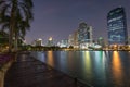 Benjakitti park and buildings in Bangkok at dusk Royalty Free Stock Photo